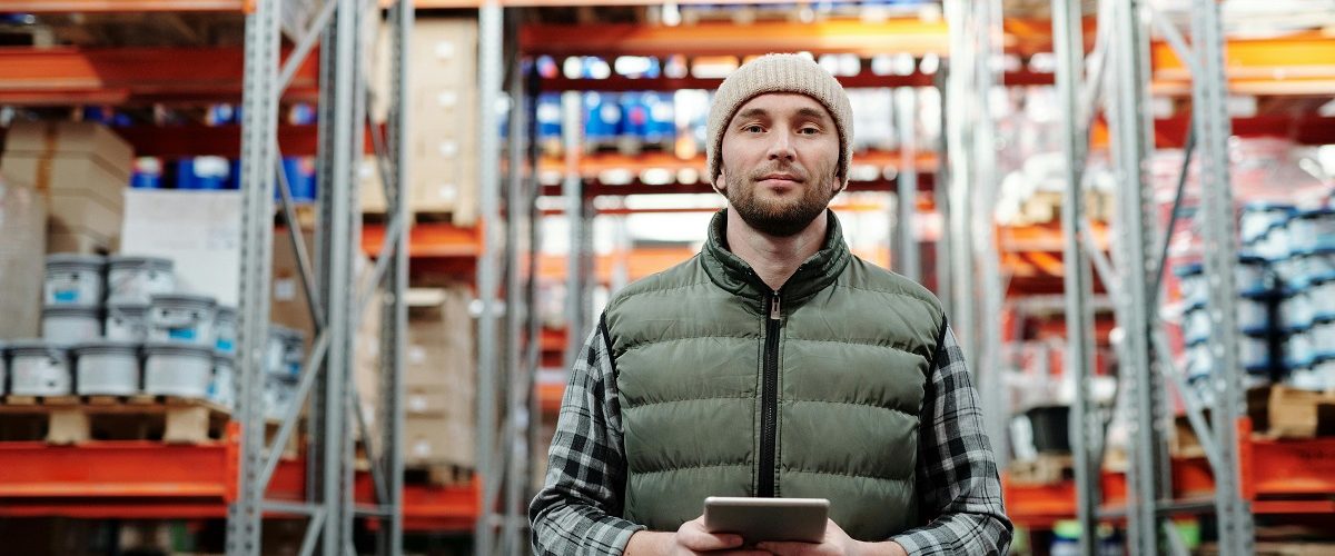 warehouse employee holding a tablet