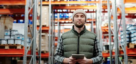 warehouse employee holding a tablet
