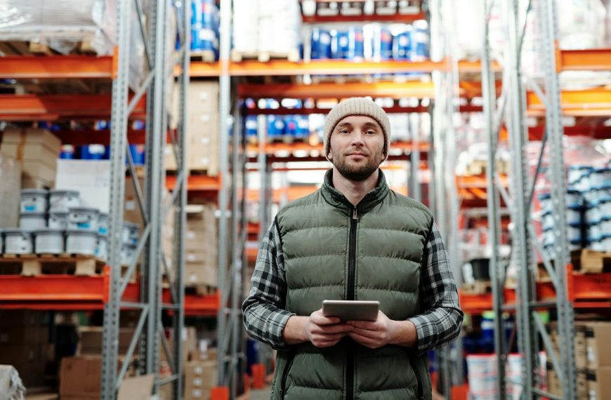 warehouse employee holding a tablet