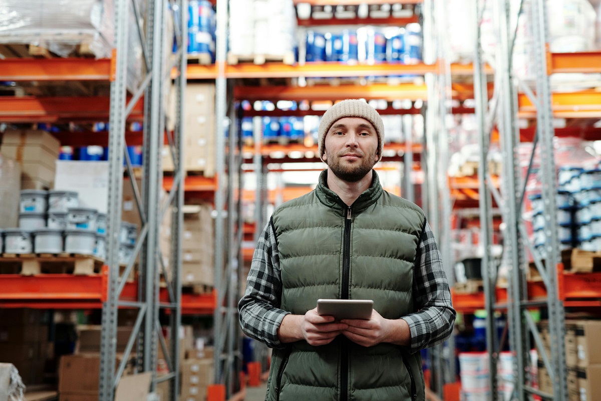 warehouse employee holding a tablet