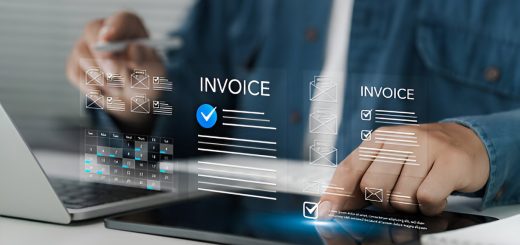 man using a laptop to manage invoices